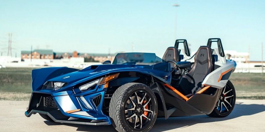 Couple smiling and riding a jet ski on calm blue water past the Miami skyline